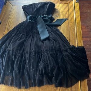 Black strapless ruffled party dress with cinched waist
